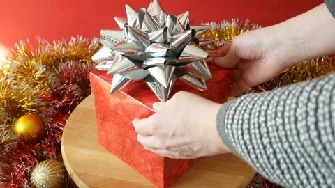 Hand open big gift box with ribbon and bow, merry chirtmas and happy new year Stock Footage 143590831