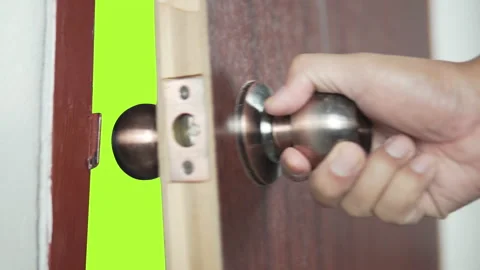 Hand open door knob on green screen Stock Footage 170914707