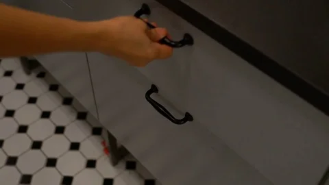 The hand open drawer and keep cheese grater into box Stock Footage 79429748