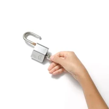 Hand open padlock with key Stock Photos