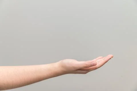 Hand with open palm facing up Stock Photos