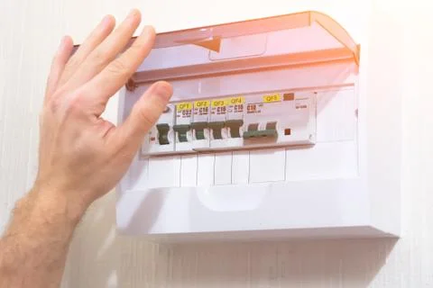 Hand is open type electric phase lightning sign, was installed on the wall Stock Photos