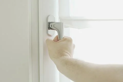 Hand open window Stock Photos