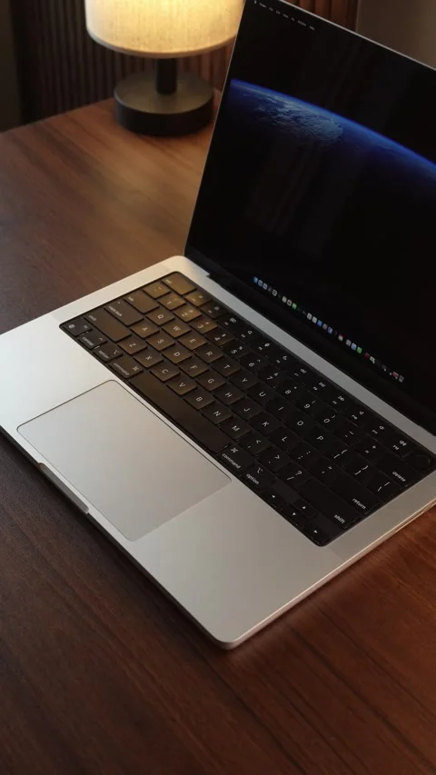 Hand Opening and Closing MacBook Lid in Warm Lighted Room Stock Footage 340967975