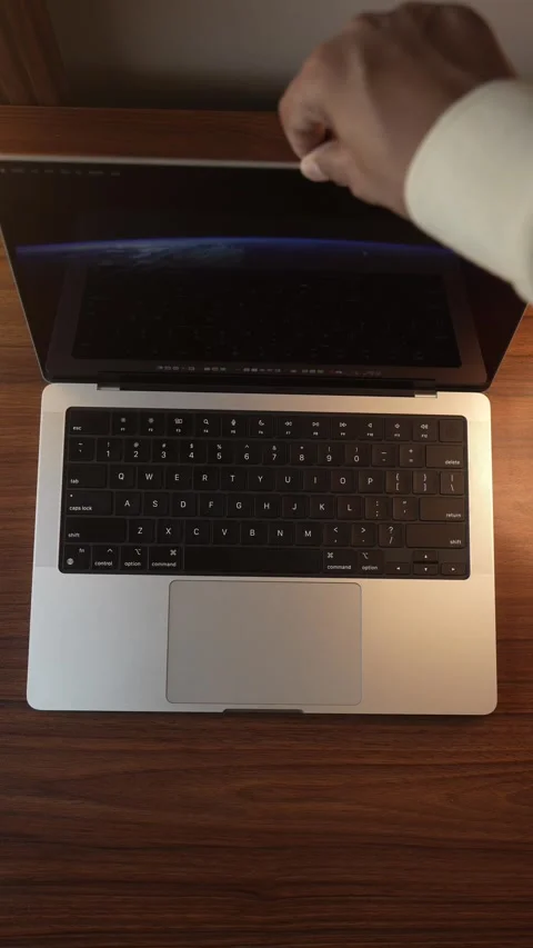 Hand Opening and Closing MacBook Lid in Warm Lighted Room Stock Footage 340967985