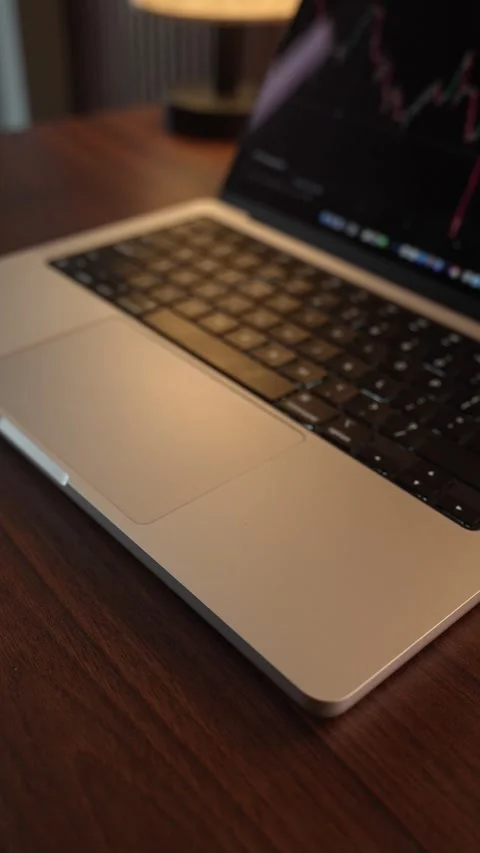 Hand Opening and Closing MacBook Lid in Warm Lighted Room Stock Footage 340968000