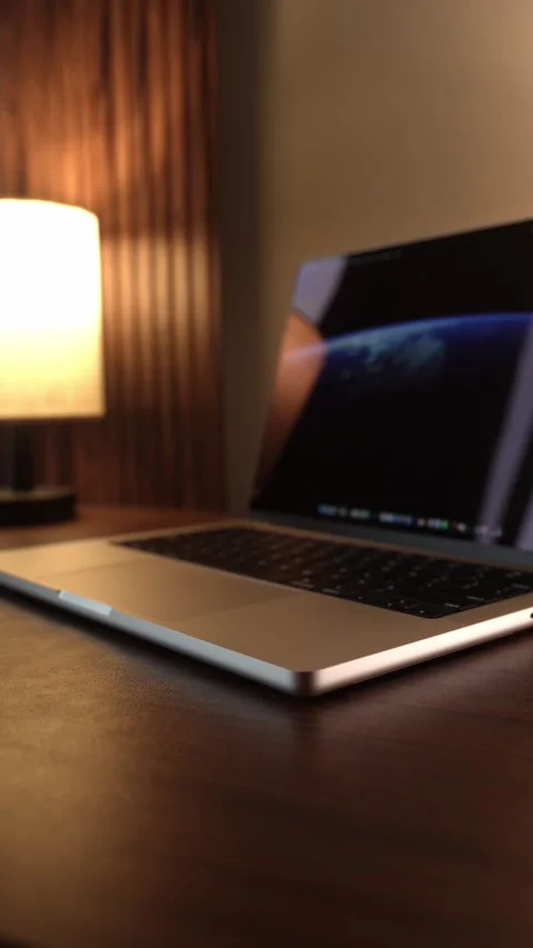 Hand Opening and Closing MacBook Lid in Warm Lighted Room Stock Footage 340968051