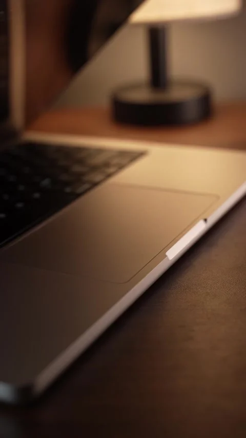 Hand Opening and Closing MacBook Lid in Warm Lighted Room 库存影片 340968093