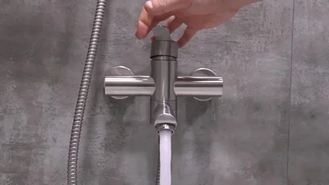 Hand opening and closing modern shower faucet Stock Footage 302539805
