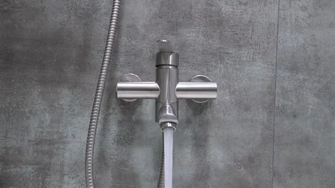 Hand opening and closing modern shower faucet Stock Footage 302540955