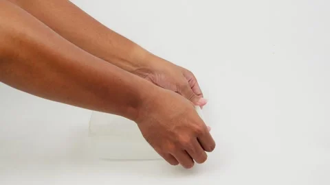 Hand Opening and Closing a Transparent Plastic Jar Stock Footage 327852577