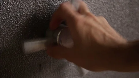 Hand opening and locking a bank safe with handle Stock Footage 86895722