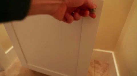 Hand opening bathroom cupboard Stock Footage 32820608