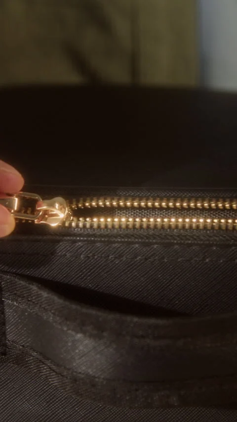 Hand Opening Black Leather Suitcase with Golden Zipper Vertical 스톡 동영상 335859855