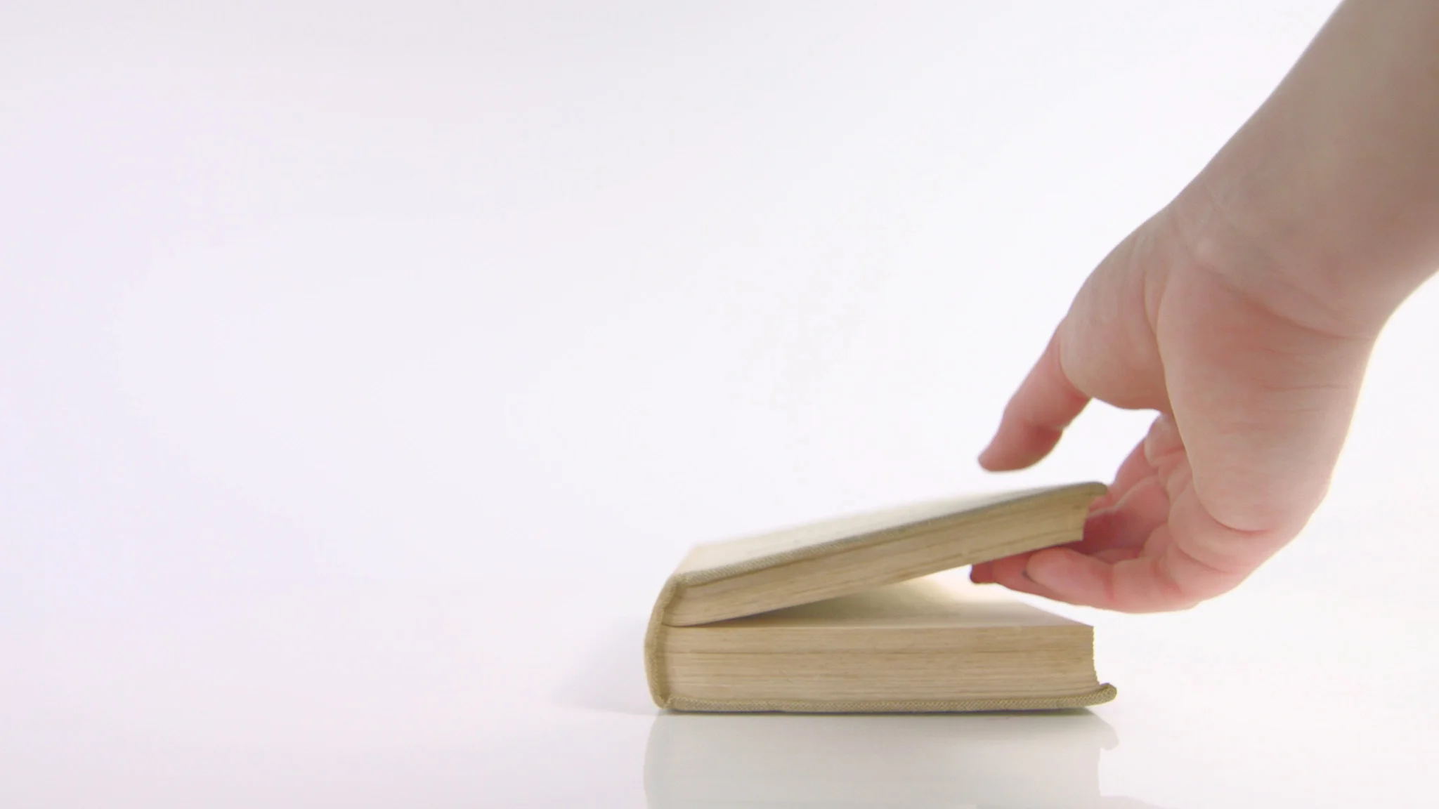 hand opening book on white background, Stock Video