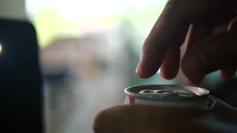 Hand opening can of cold beer in 4K Resolution Stock Footage 131691418