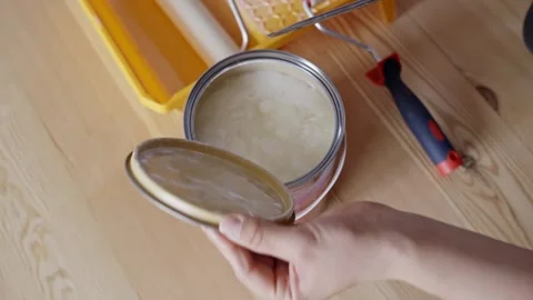 Hand Opening A Can Of Varnish For Protecting Exterior Of Wood Surfaces With A Stock Footage 313250491