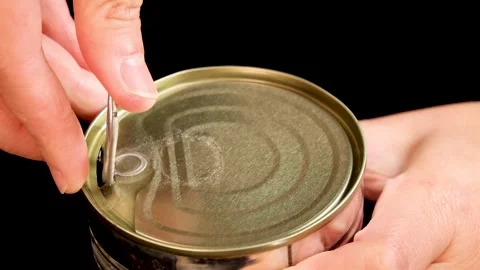 Hand Opening Canned Beans with Pull Tab in Close-Up Video stock 313786467