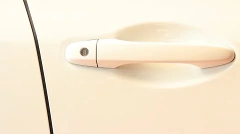 A hand opening a car door with a key Stock Footage 21504680