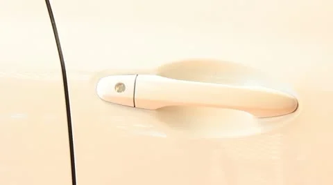 A hand opening a car door with a key Stock Footage 21505679