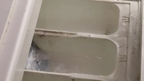 Hand opening dirty detergent drawer of washing machine, cleaning need visib.. Stock Footage 319825582