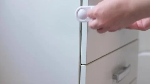 Hand opening door. children proof door locks	 Stock Footage 130345443