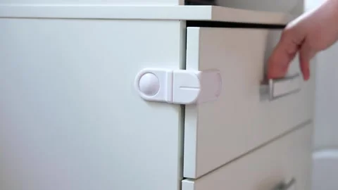 Hand opening door. children proof door locks	 Stock Footage 130345472