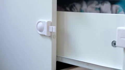 Hand opening door. children proof door locks	 Stock Footage 130345488
