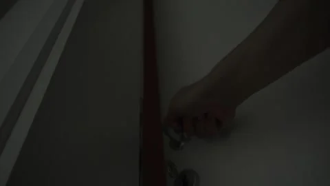 Hand Opening a Door in Dim Light Stock Footage 278938247