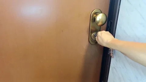 Hand opening a door with a key, Marina di Carrara, Italy, September 14, 2026 Stock Footage 345522534
