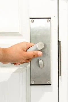 Hand opening door Stock Photos