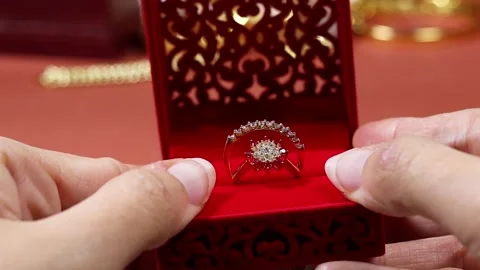 Hand opening a Engagement Ring In Red Velvet Box Held During Romantic Proposal Stock Footage 331600026