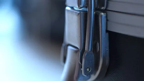 Hand opening guitar case lock. Beginning or performance concept. close up video. Stock Footage 102048808