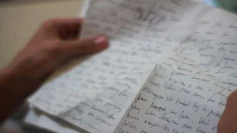 Hand opening a letter from someone Stock Footage 278148401