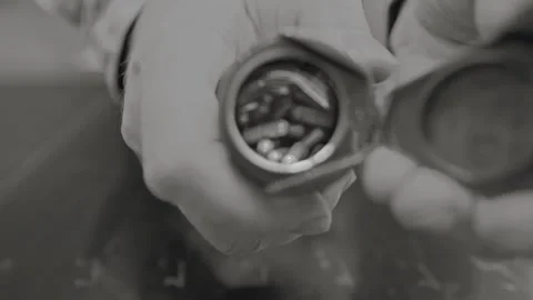Hand Opening Medicine Bottle With Silver Pills Close Up 스톡 동영상 340503958