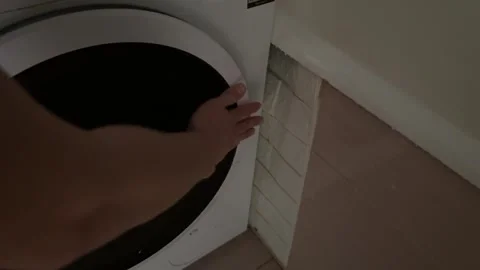Hand opening or closing washing machine door, household laundry appliance use Stock Footage 337121017