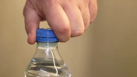 Hand Opening Plastic Bottle With Attached Tethered Cap Video stock 346559662
