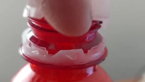 Hand Opening Plastic Cap of Red Beverage Bottle Close Up Stock Footage 333642087