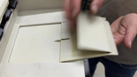 Hand opening plastic paper tray holder in home printer Stock Footage 336977326