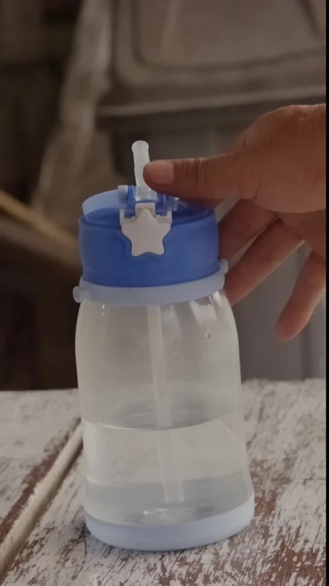 Hand opening plastic water bottle, refreshing hydration, daily healthy habi.. Stock Footage 320127612