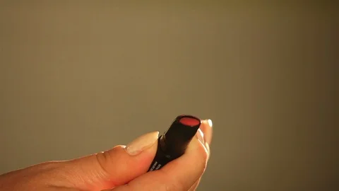 Hand opening red lipstick Stock Footage 89342035