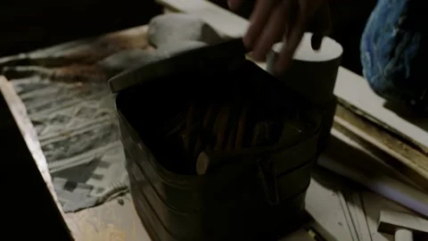 Hand is opening a rusty box full of rusty nails and hummer. Repair tools. Stock Footage 199036916