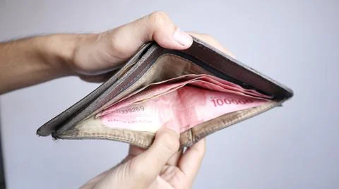Hand opening a wallet 写真素材
