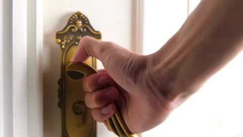 Hand opening white door with decorative brass door handle 스톡 동영상 332282307