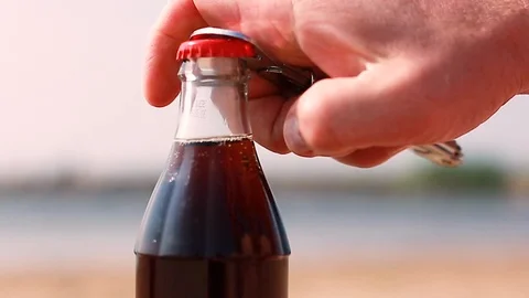 Hand opens a bottle Stock Footage 114448416