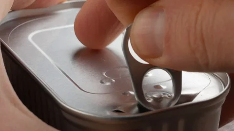 The hand opens the canned Stock Footage 106934456