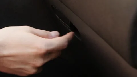 Hand opens car glove box slow motion video Stock Footage 90809955
