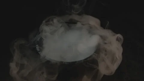 Hand Opens Cauldron Lid and Starts Spewing Smoke in Slow-Mo Stock Footage 139167514