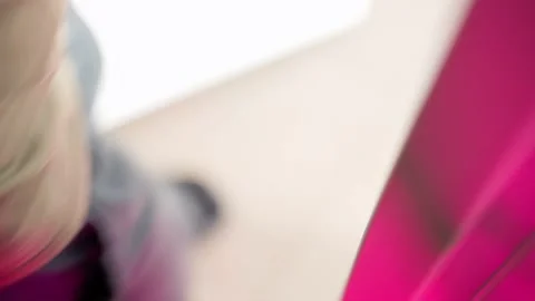 A hand opens a close-up of the handle of a white plastic door under a bright Stock Footage 217976440