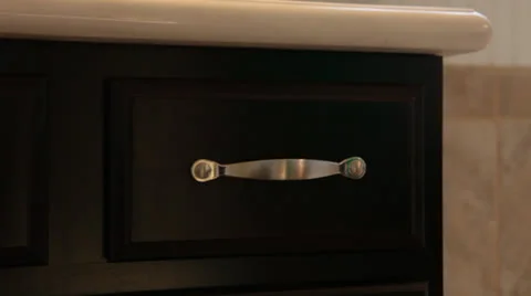Hand opens &amp; closes bathroom drawer, close-up 2 Stock Footage 25912714